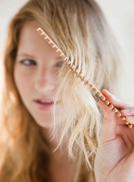 Blonde woman combing. Photo: Jamie Grill