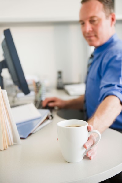 Businessman working in office. Photo: Jamie Grill