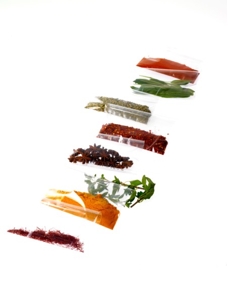 Studio shot of row of packets with spices. Photo: David Arky