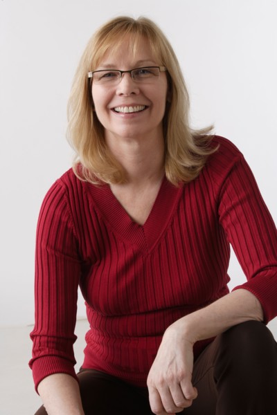 Portrait of mature woman, studio shot. Photo: Rob Lewine