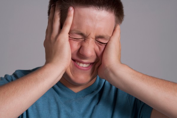 Portrait of frustrated teenager, studio shot. Photo: Rob Lewine