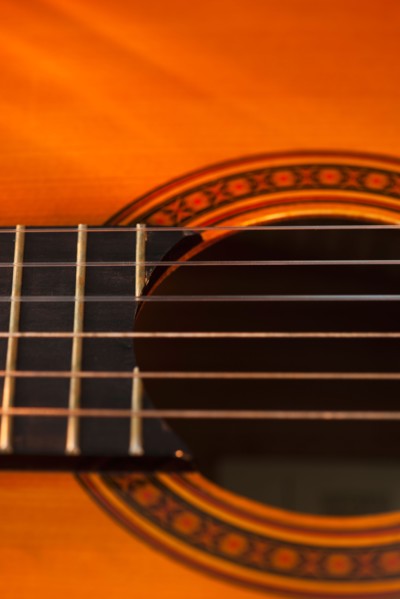 Close up of sound hole of acoustic guitar. Photo: Daniel Grill