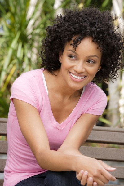 Portrait of young woman smiling. Photo : Rob Lewine