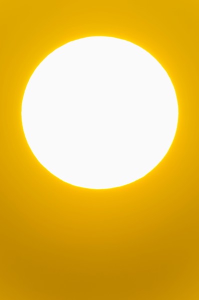 Close-up of large red sun.