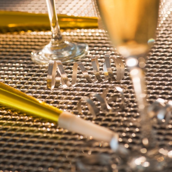 Flutes with champagne and party horn blowers. Photo: Daniel Grill