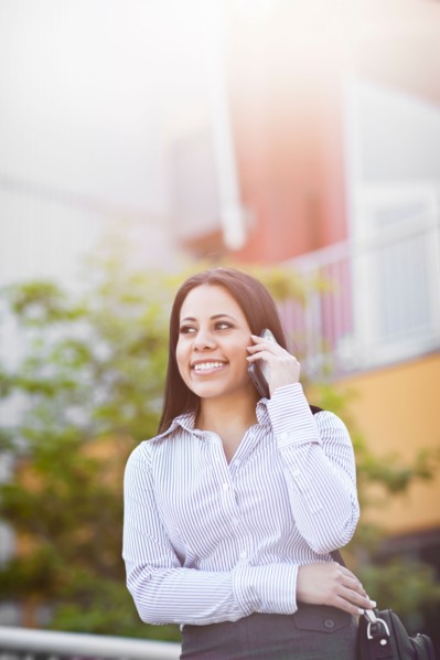 Young businesswoman talking on phone. Photo: Take A Pix Media