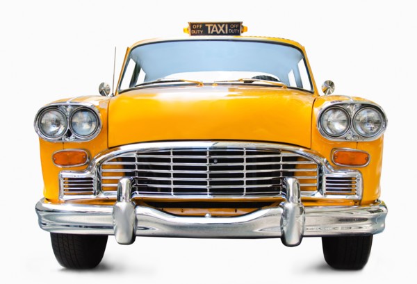 Classic yellow cab on white background.
