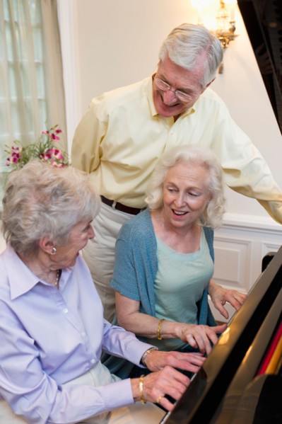 Seniors playing piano and singing.