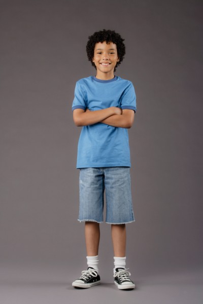 Portrait of smiling boy (8-9), studio shot. Photo : Rob Lewine