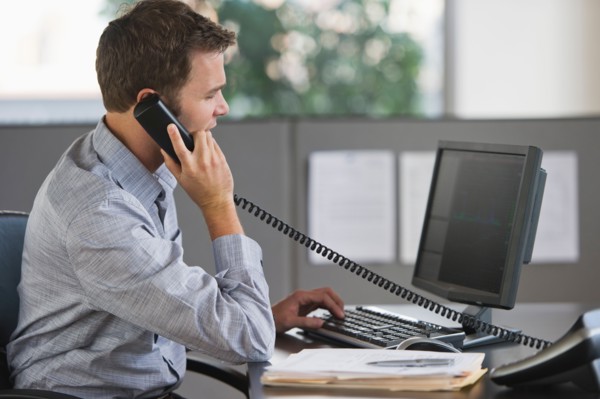 Young man working in office.