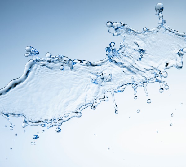 Studio shot of water splash on blue background.