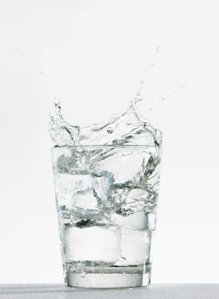 Studio shot of glass of water with splash.
