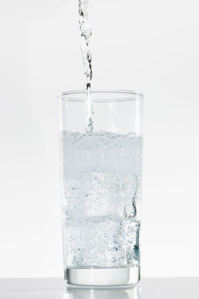 Studio shot of water being poured into glass.