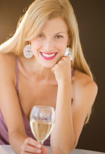 Portrait of mid adult woman drinking wine.