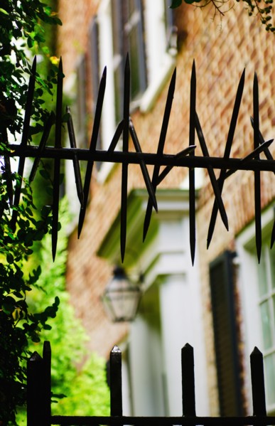 USA, South Carolina, Charleston, Close up of iron spikes on fence.