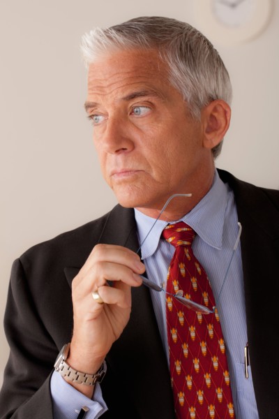 Studio portrait of senior businessman. Photo : Rob Lewine
