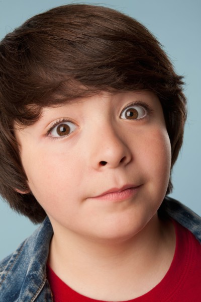 Studio portrait of boy (10-11) staring at camera. Photo: Rob Lewine