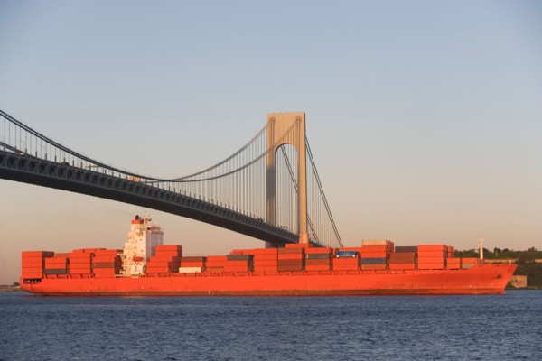 USA, New York State, New York City, Brooklyn, Container Ship under Verrazano-Narrows Bridge. Photo