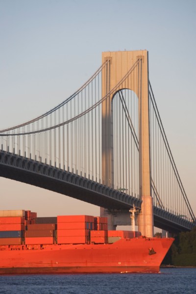USA, New York State, New York City, Brooklyn, Container Ship under Verrazano-Narrows Bridge. Photo