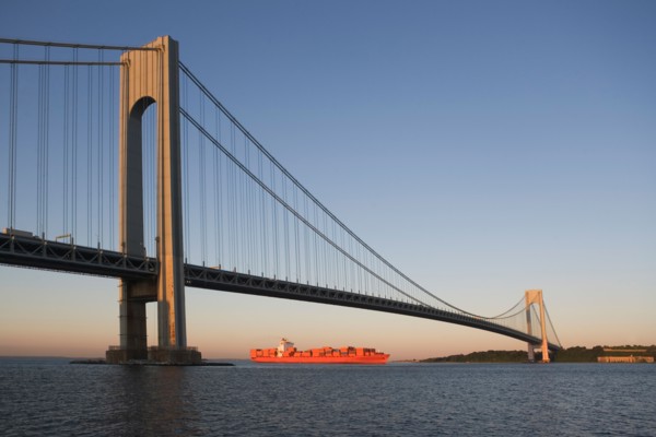 USA, New York State, New York City, Brooklyn, Container Ship under Verrazano-Narrows Bridge. Photo