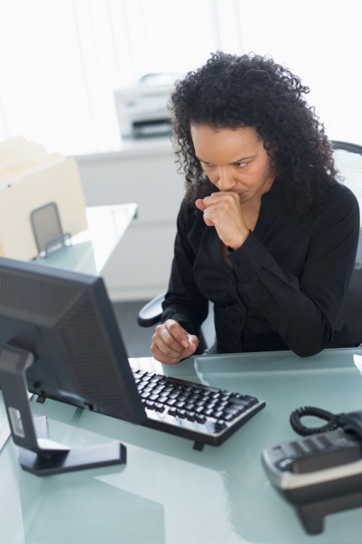 Business woman using computer.