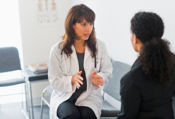 Doctor with patient in office.
