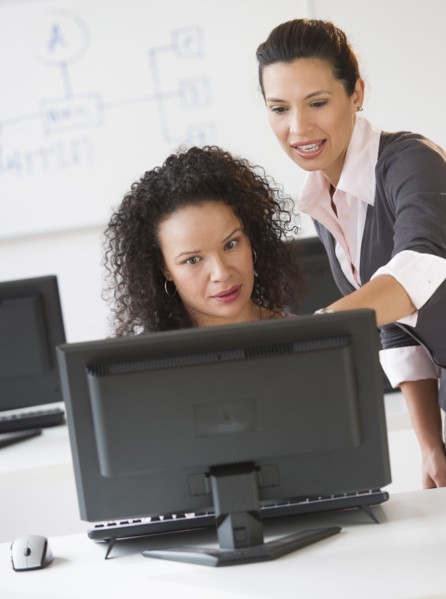 Business women using computer in office.