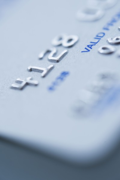 Detail of credit card, studio shot.