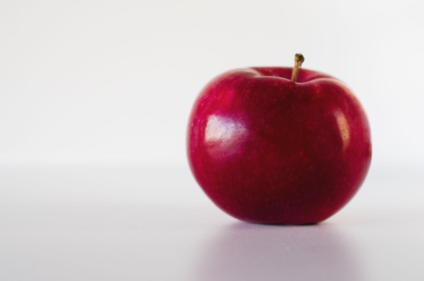 Red apple on white background.