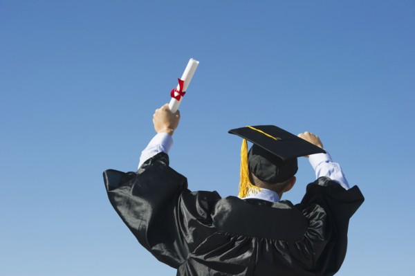 Teenage boy (16-17) at his graduation ceremony.