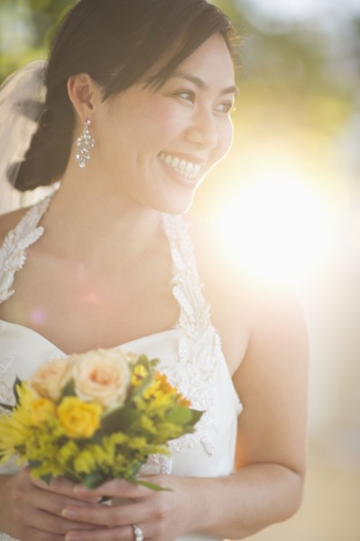 Portrait of bride holding bouquet.