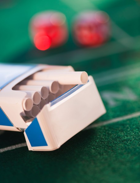 Close up of open cigarette pack on casino table. Photo: Daniel Grill