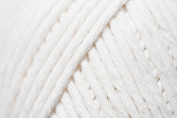 Close-up of ball of white yarn. Photo : Kristin Lee