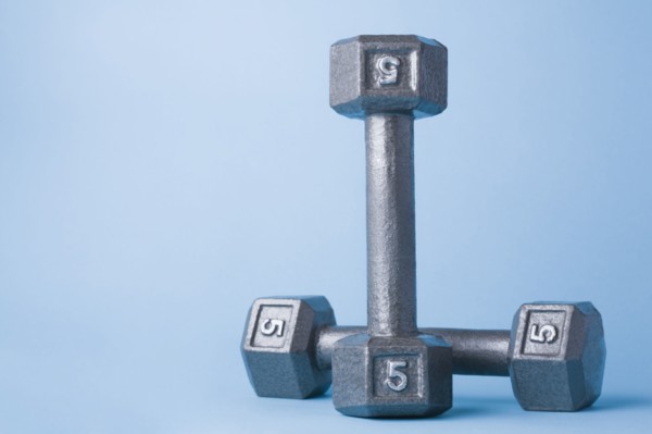 Studio shot of metal dumbbells. Photo : Kristin Lee