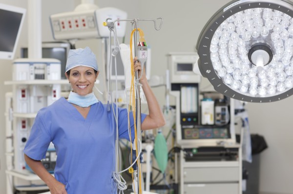 Portrait of female surgeon in operating room. Photo : db2stock