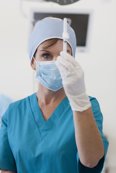 Surgeon preparing injection. Photo : db2stock