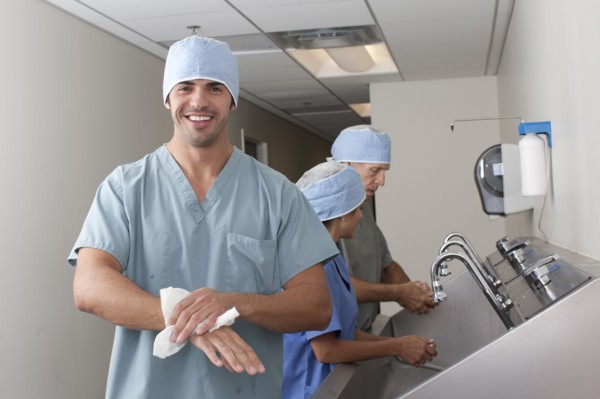 Surgeons washing hands in hospital. Photo : db2stock