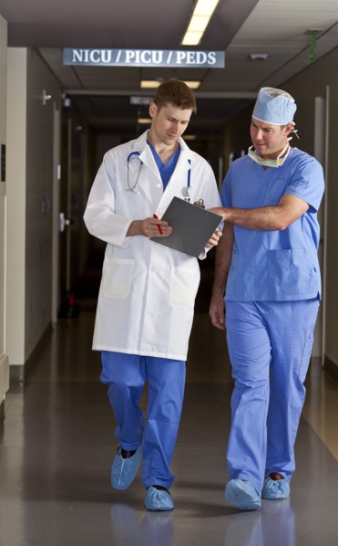Doctor and surgeon walking in corridor. Photo: db2stock