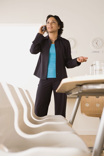 Businesswoman talking on phone. Photo : Rob Lewine