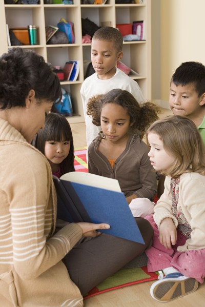 Teacher and children (6-7) at school. Photo : Rob Lewine