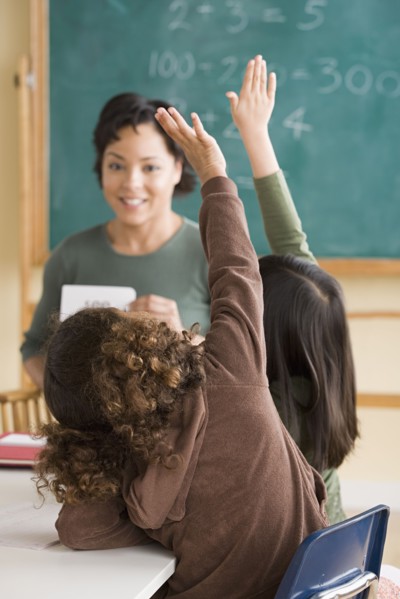 Teacher and children (6-7) at school. Photo : Rob Lewine