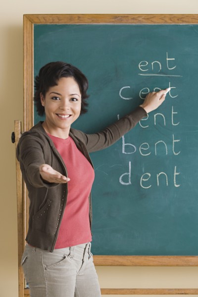 Teacher showing words on blackboard. Photo : Rob Lewine