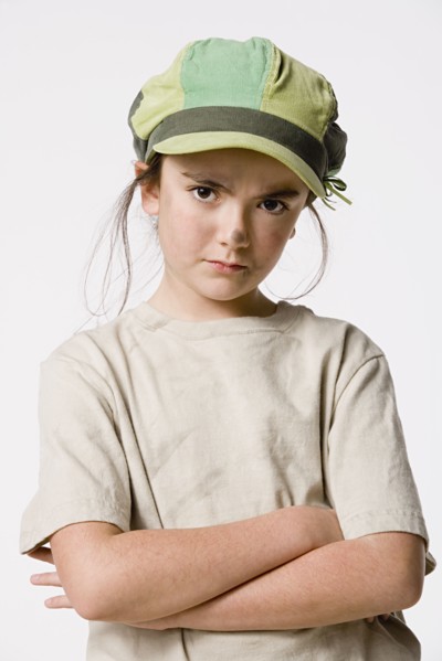 Studio portrait of sly girl (8-9). Photo: Rob Lewine