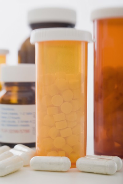 Close up of pill containers. Photo: Rob Lewine
