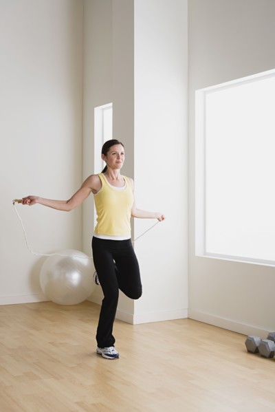 Woman exercising with jump rope. Photo: Rob Lewine