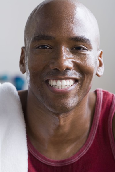 Portrait of male athlete smiling. Photo : Rob Lewine