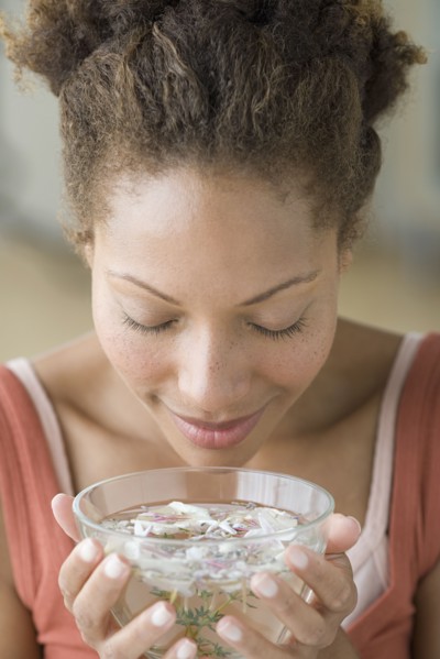 Woman relaxing with aromatherapy. Photo : Rob Lewine
