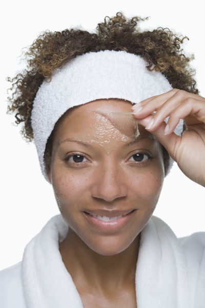 Portrait of attractive woman with facial mask. Photo : Rob Lewine
