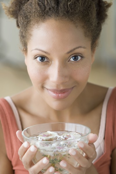 Woman enjoying aromatherapy. Photo: Rob Lewine