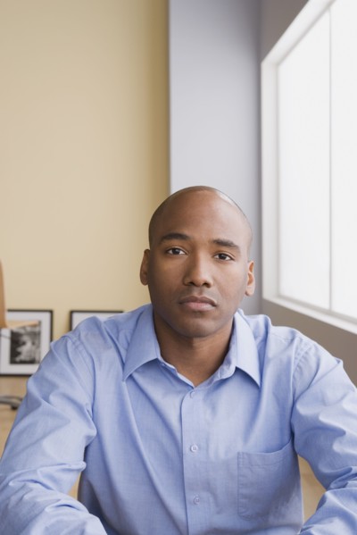 Portrait of mid adult businessman. Photo : Rob Lewine
